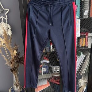 Divided Navy Joggers with Bold Red Stripes